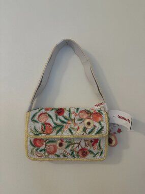 pink and yellow peach beaded shoulder bag with peach bag charm made in india